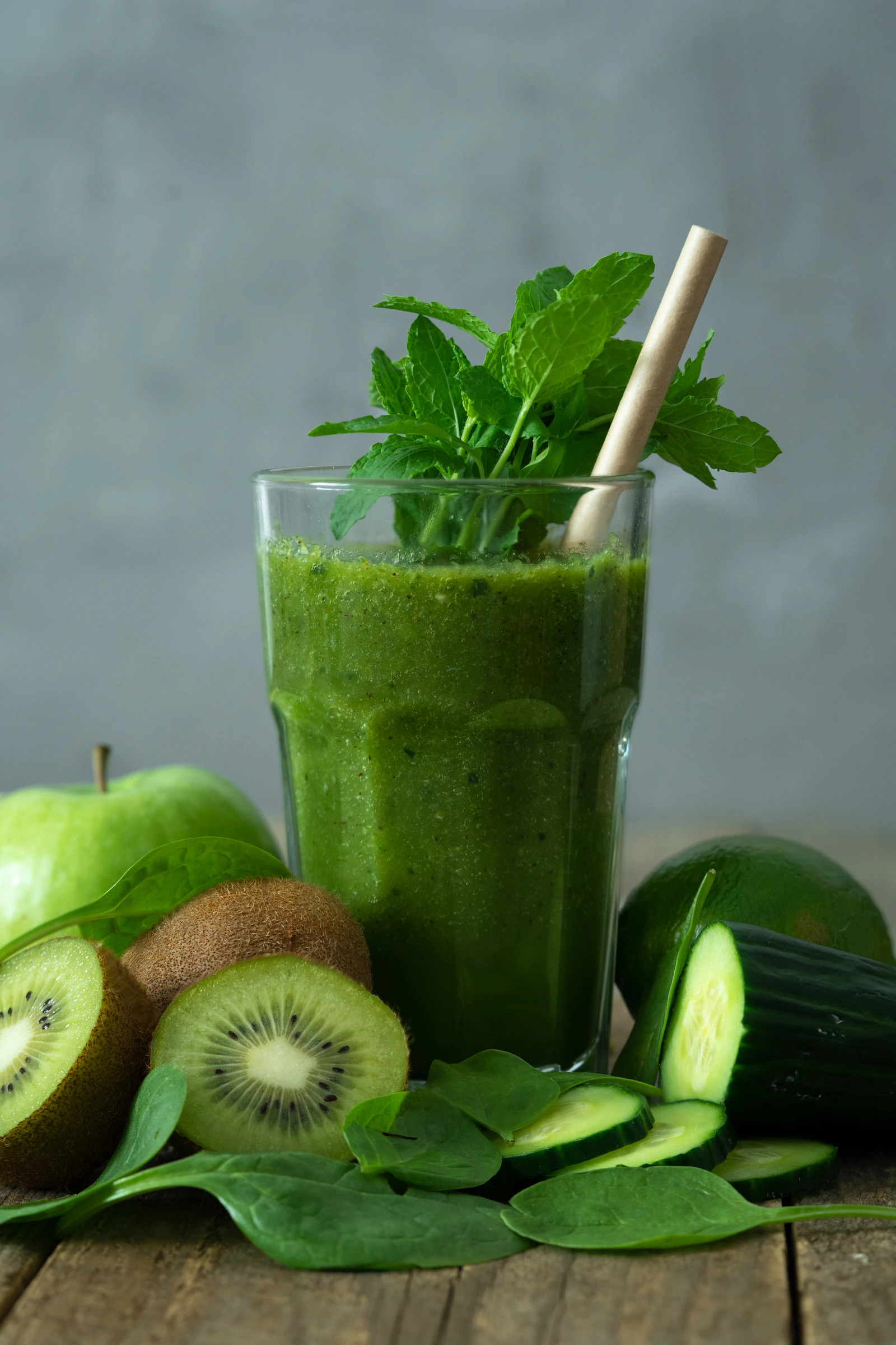 Editorial image of a green nutrient powder being mixed with water — representative of the AG1 product category. Photograph via Unsplash.