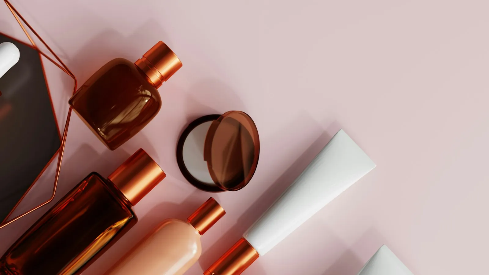 Modern cosmetics products arranged on a soft-pink background